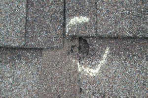 asphalt shingle puncture from hailstones