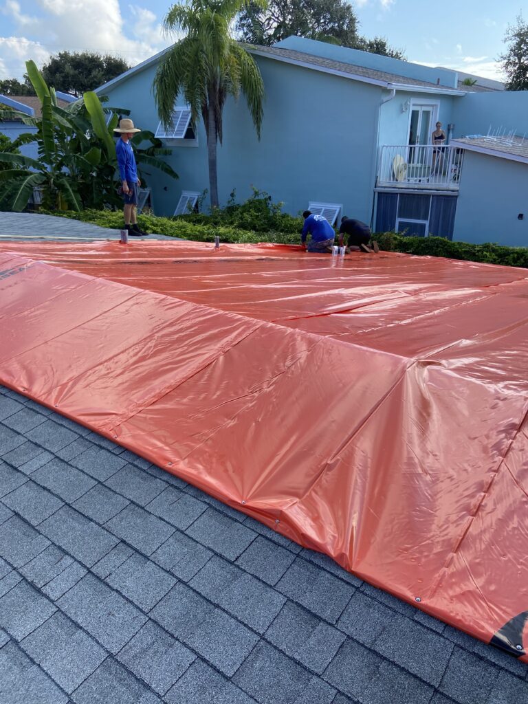 Orange Stormseal roof wrap for protecting home